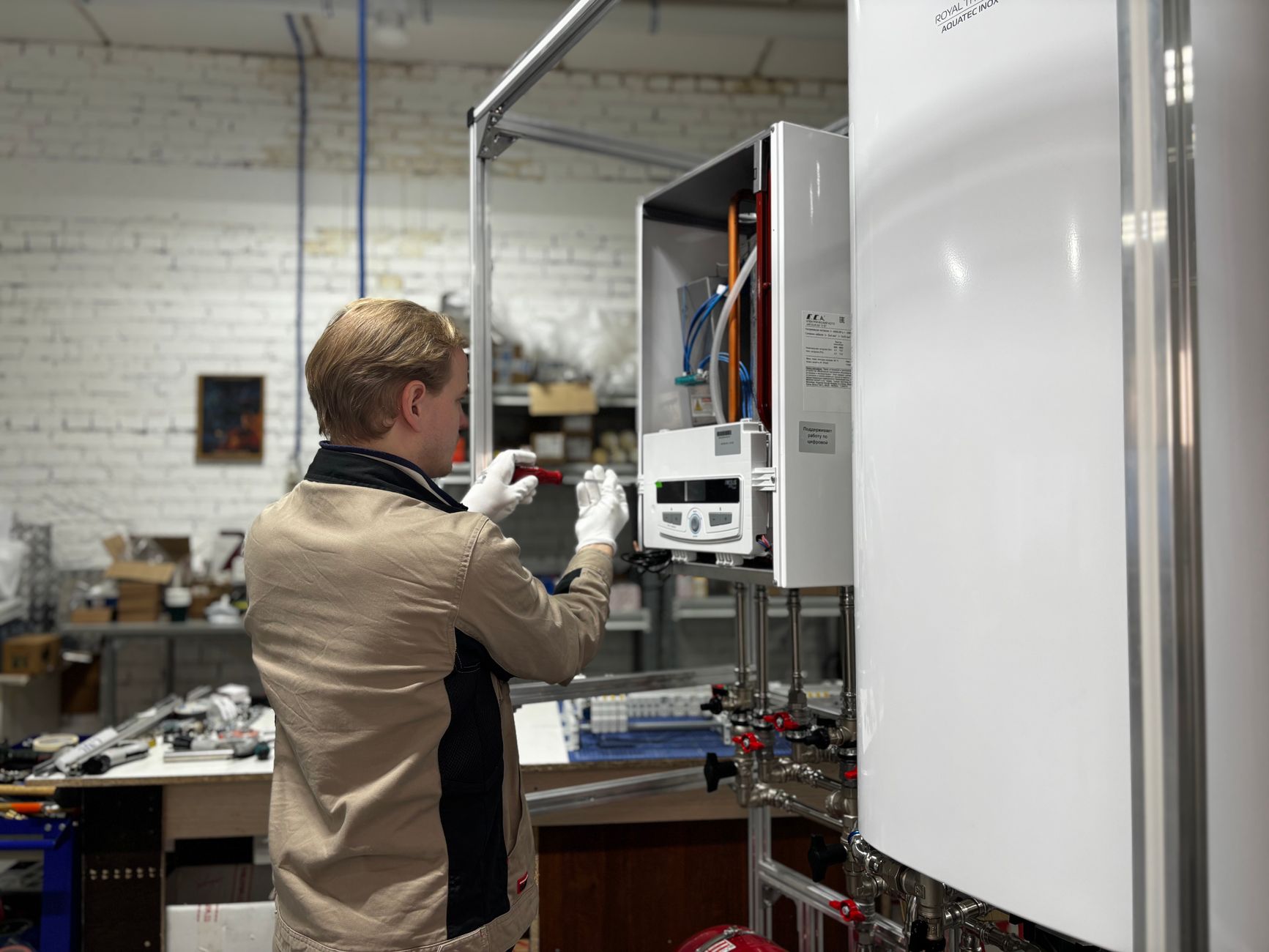 Technician inspecting equipment in a workshop setting